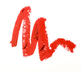 Red color lipstick stroke on white paper