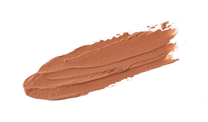 Brown color lipstick stroke on white background