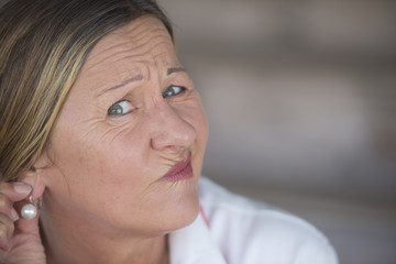 Concerned worried mature woman portrait