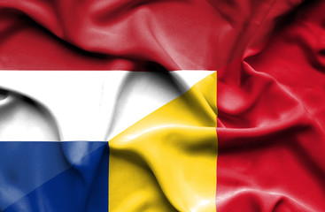 Waving flag of Romania and Netherlands