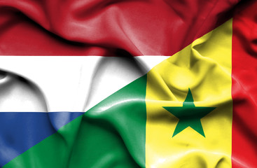 Waving flag of Senegal and Netherlands