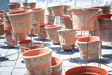 many empty flowerpots