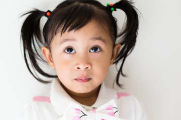 Adorable girl looking up