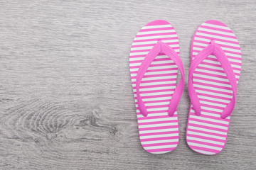 Flip flop on wooden background