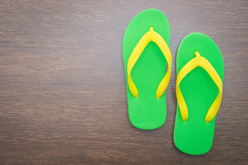 Flip flop on wooden background