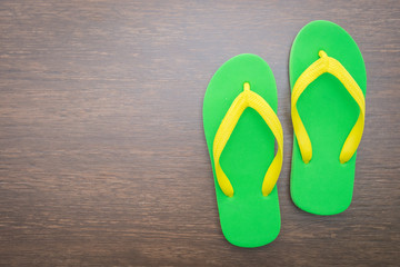 Flip flop on wooden background