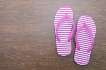 Flip flop on wooden background