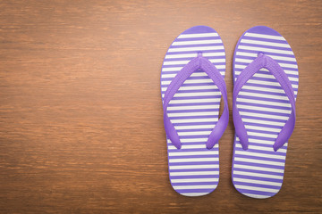 Flip flop on wooden background