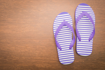 Flip flop on wooden background