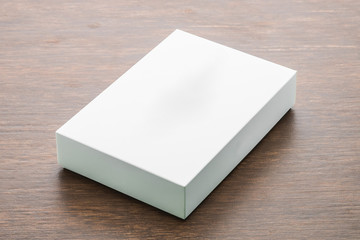 Blank box mock up on wooden background