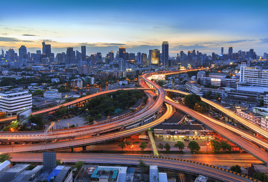 Bangkok city at twilight and main traffic high way, office building