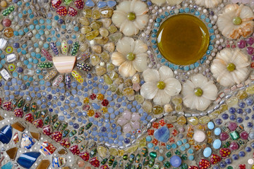 the colorful broken tile, bead and stone decorating on temple wa