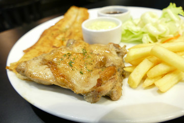 fish steak and grilled chicken with sauce