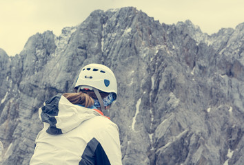 Alpinst looking at mountain wall.