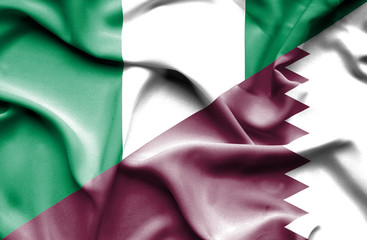 Obraz premium Waving flag of Qatar and Nigeria