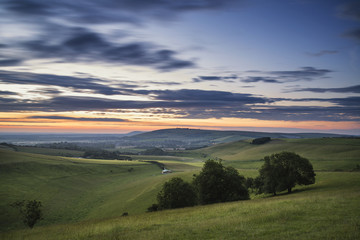 Beautiful Summer sunset landscape Steyning Bowl on South Downs