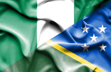 Waving flag of Solomon Islands and Nigeria
