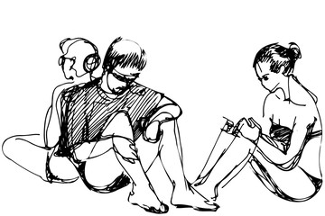 guy and two girls resting on the beach