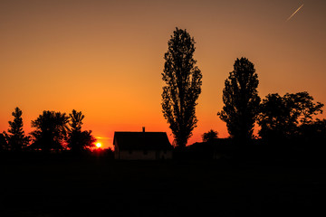 Sunset over a county house