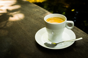 cup of coffee espresso on the wood desk
