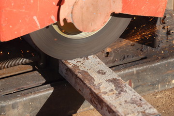 cutting a metal and steel with compound mitre saw with sharp