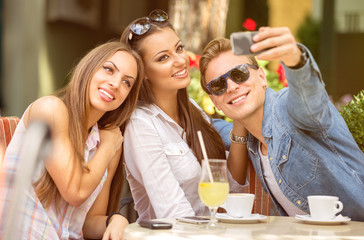 group of friends having fun with a smart phone