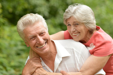 Senior couple  in summer forest