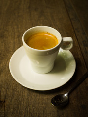 cup of coffee espresso on the wood desk