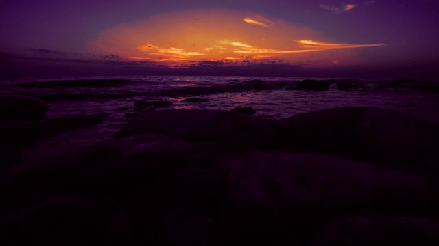 Timelapse of Amazing sunset on the pebble beach