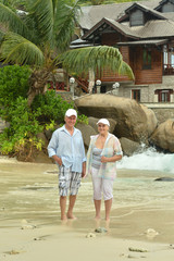 Elderly couple  in tropical garden