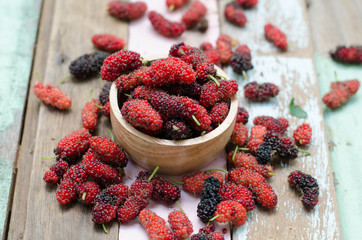 Fresh mulberry in wooden bowl