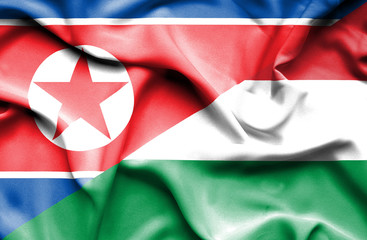 Waving flag of Hungary and North Korea