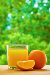 Orange and glass on the table