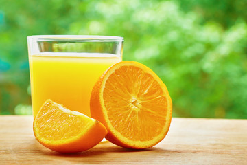 Orange and glass on the table