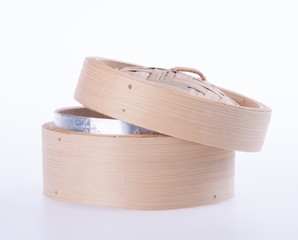Bamboo steamer or dim sum steamer on background.