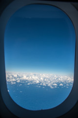 Fototapeta na wymiar Blue sky outside the window of the air plane over Sydney, Australia.