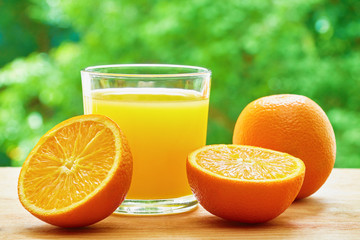 Orange and glass on the table
