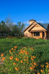 wooden country house with lawn