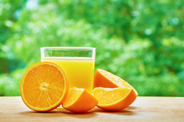 Orange and glass on the table