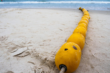 Obraz premium Yellow Buoy on Beach