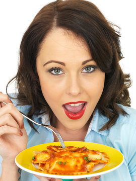 Pretty Attractive Young Woman Holding and Eating a Plate of Ravioli