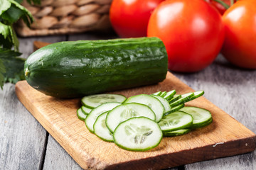 Chopped vegetables: cucumber on cutting board
