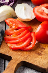 Chopped vegetables: tomatoes on cutting board