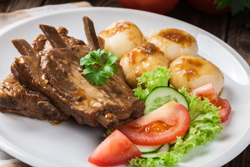 Pork spareribs served with silesian noodles and sauce