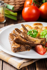 Pork spareribs served with silesian noodles and sauce