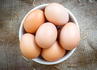 group of raw eggs put on old sack