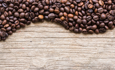 Background with coffee beans and wood texture