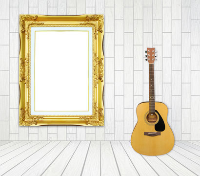 Guitar and picture frame in room