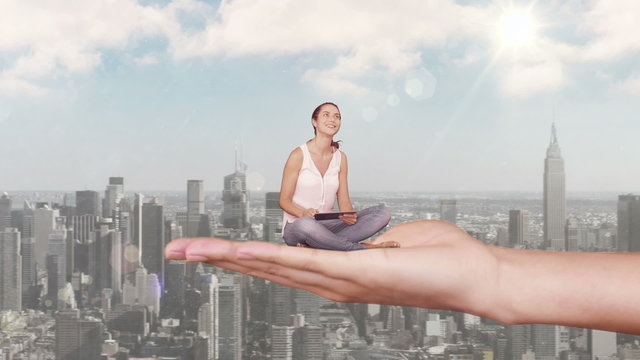 Hand holding sitting casual woman focused on tablet computer abo