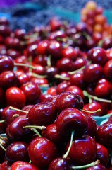 Fresh red cherries in bulk at the market